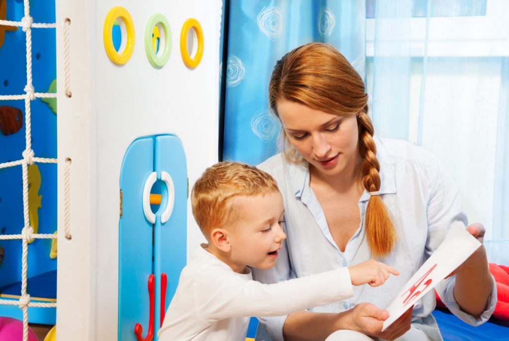 image of the adult lady teaching the kid