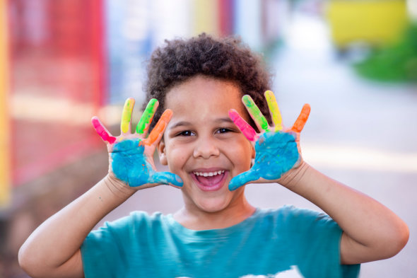 image of the kid with his painted hand