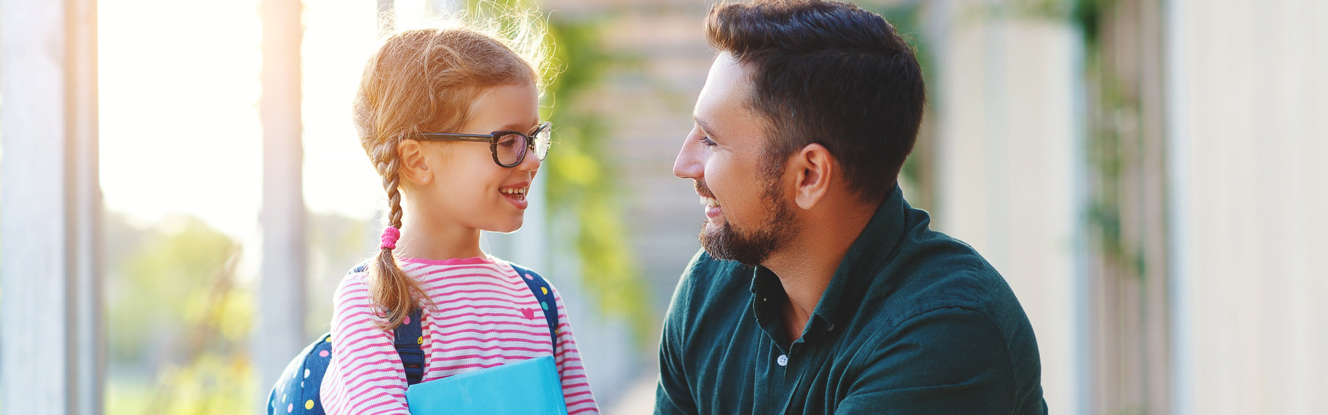 father taking his daughter to school