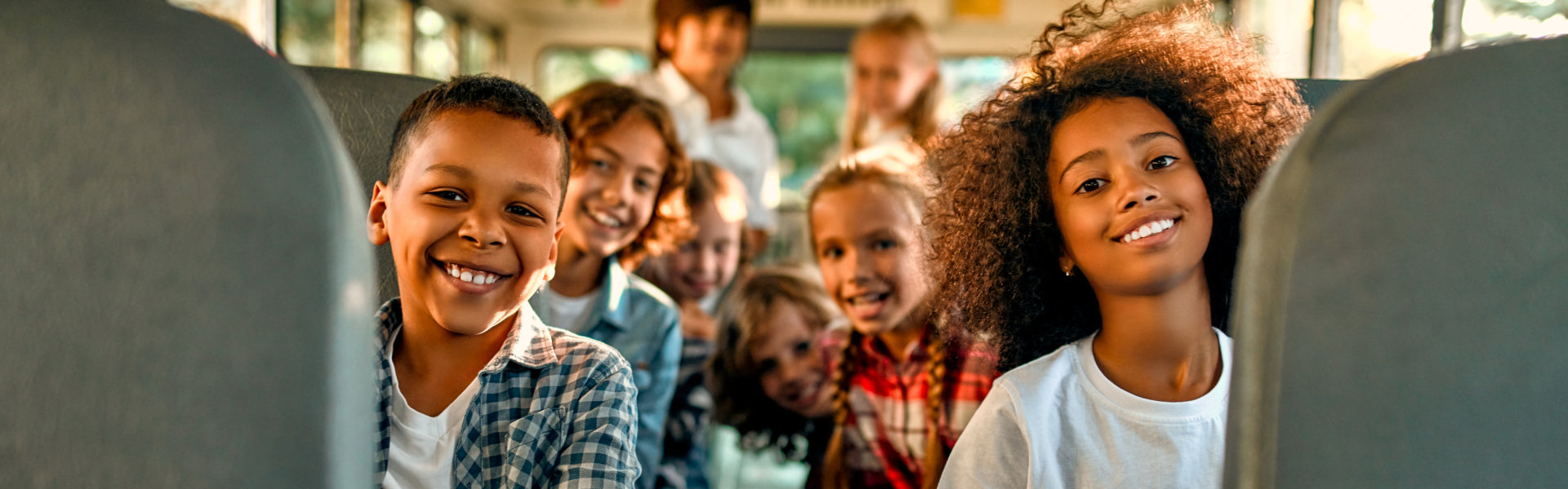 children sitting in the bus