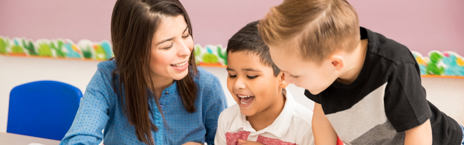 teacher teaching her students how to write