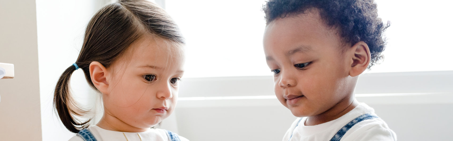 a boy and a little girl playing