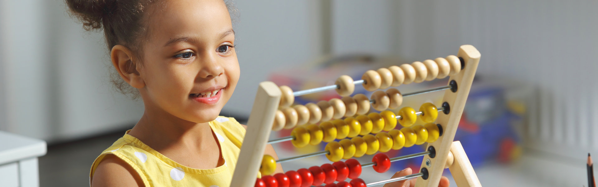 girl counting with an abacus