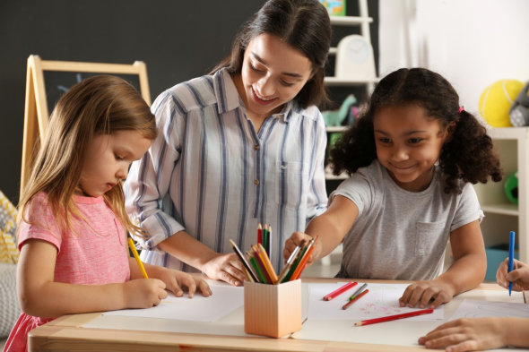 image of the teacher, teaching the students