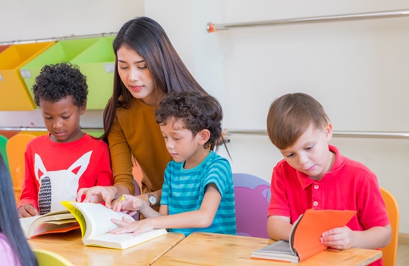 image of the teacher teaching her students